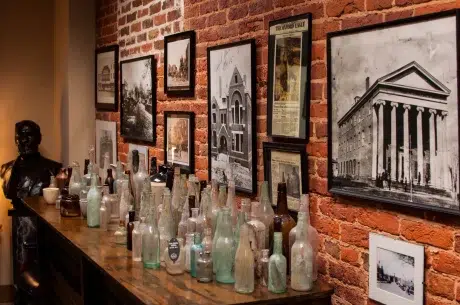 Tollison And Webb Interior Tollison &Amp; Webb P.a. Interior With Historic Bottles Recovered From Building Collapse.